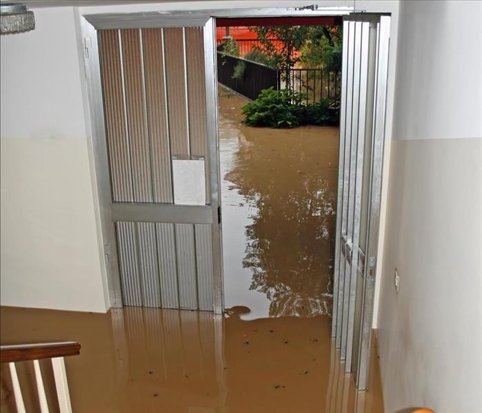 Entrance of a house fully flooded during flooding
